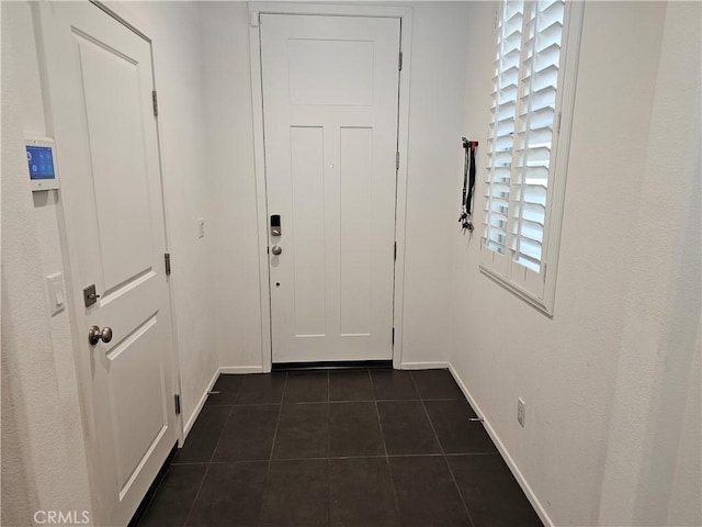 29604 Kyles Cir, Winchester, CA 92596 - doorway featuring dark tile patterned floors and baseboards