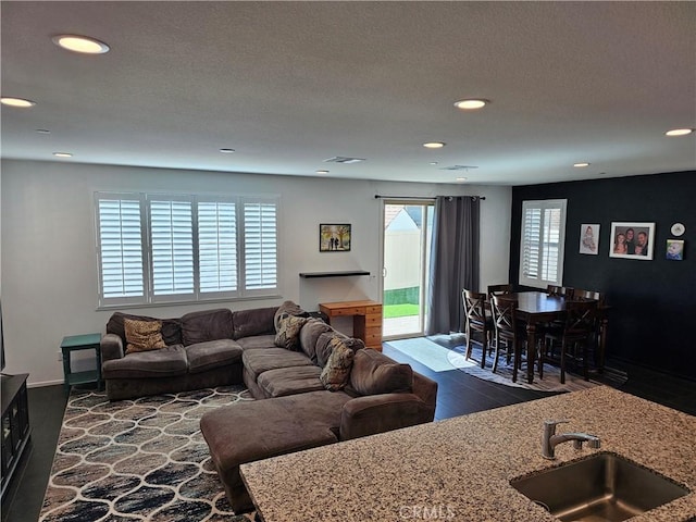 29604 Kyles Cir, Winchester, CA 92596 - living room featuring recessed lighting and dark wood-type flooring