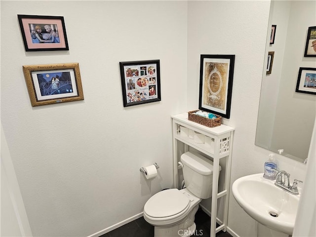 29604 Kyles Cir, Winchester, CA 92596 - half bathroom with baseboards and tile patterned floors