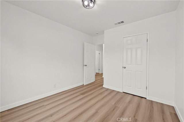 13612 Mercer St, Pacoima, CA 91331 - unfurnished bedroom with wood finished floors and baseboards
