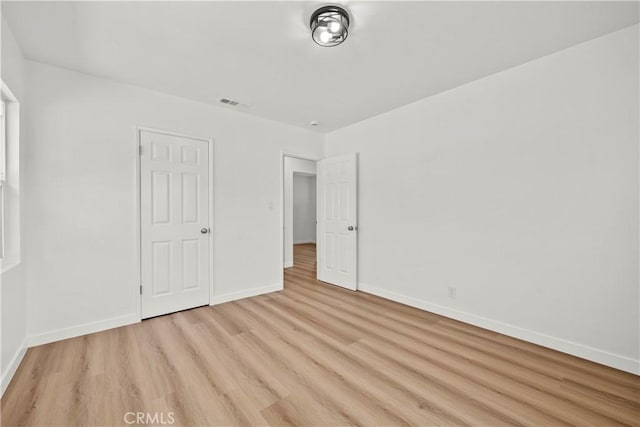 13612 Mercer St, Pacoima, CA 91331 - unfurnished bedroom with light wood finished floors and baseboards
