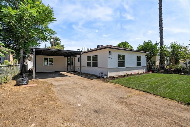 13612 Mercer St, Pacoima, CA 91331 - manufactured / mobile home featuring driveway, an attached carport, and stucco siding