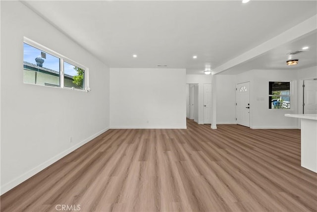 13612 Mercer St, Pacoima, CA 91331 - unfurnished living room with recessed lighting, healthy amount of natural light, and light wood finished floors