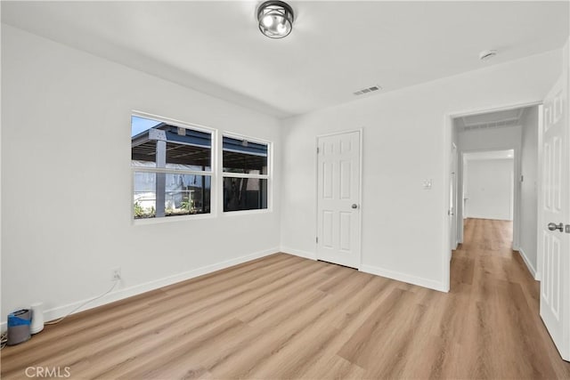 13612 Mercer St, Pacoima, CA 91331 - unfurnished bedroom featuring light wood finished floors and baseboards