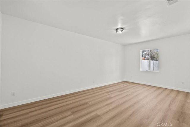 13612 Mercer St, Pacoima, CA 91331 - empty room with light wood finished floors and baseboards