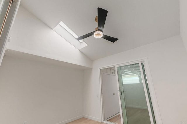 3755 N Vista Campana Unit 30, Oceanside, CA 92057 - empty room with vaulted ceiling, a skylight, and light wood-type flooring
