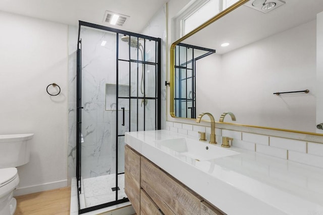 3755 N Vista Campana Unit 30, Oceanside, CA 92057 - bathroom featuring vanity, a marble finish shower, and wood finished floors