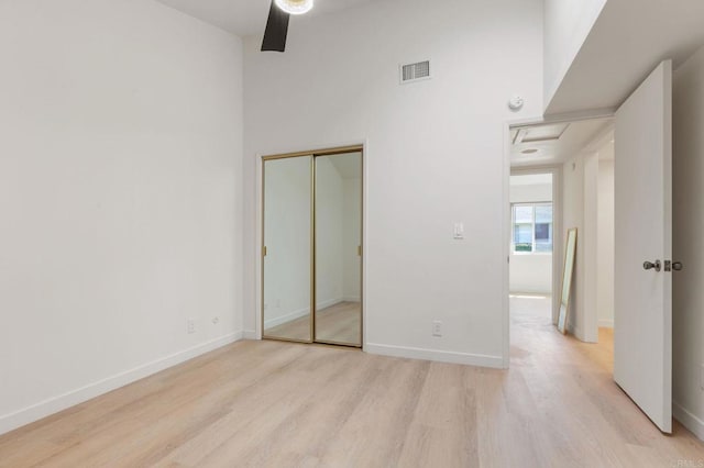 3755 N Vista Campana Unit 30, Oceanside, CA 92057 - unfurnished bedroom with light wood-style floors, a closet, and a ceiling fan
