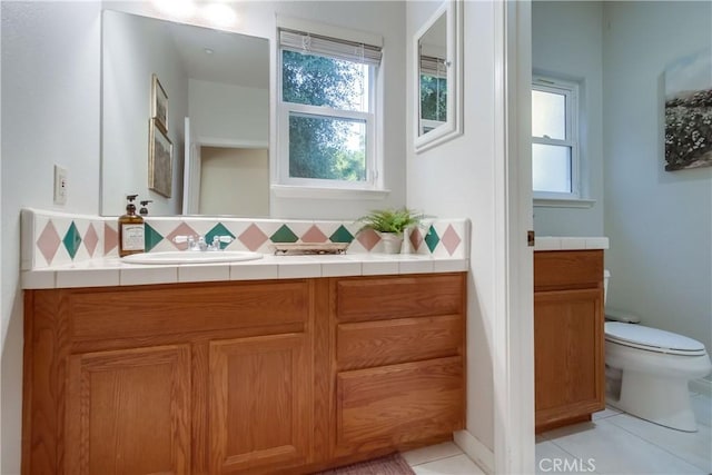 2424 Gird Rd, Fallbrook, CA 92028 - bathroom featuring vanity, backsplash, healthy amount of natural light, and tile patterned flooring