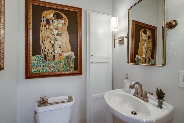 2424 Gird Rd, Fallbrook, CA 92028 - half bathroom featuring a sink and toilet