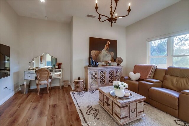 2424 Gird Rd, Fallbrook, CA 92028 - living room featuring wood finished floors and a chandelier