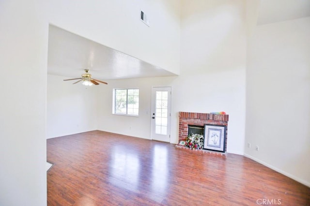 17076 E Cypress, Covina, CA 91722 - unfurnished living room with wood finished floors, a ceiling fan, and a fireplace