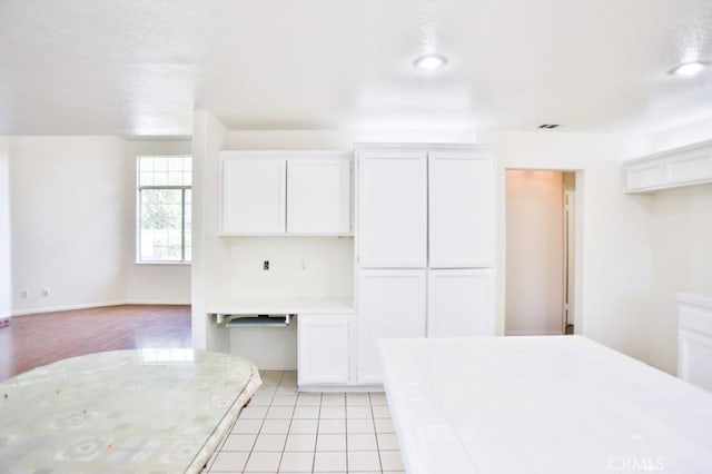 17076 E Cypress, Covina, CA 91722 - kitchen with tile countertops, white cabinetry, light tile patterned floors, and recessed lighting