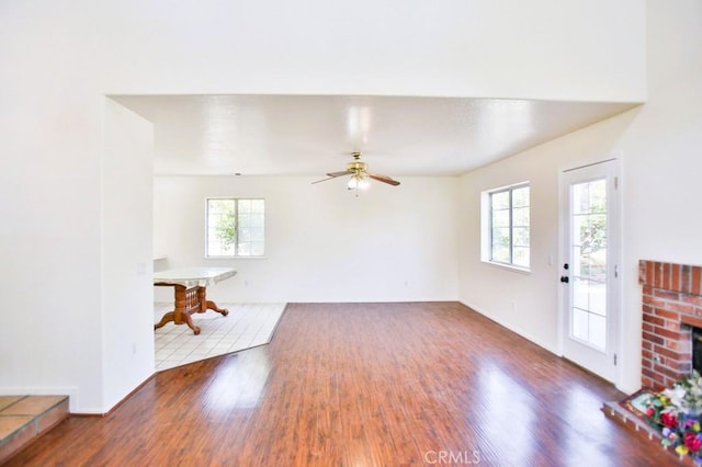 17076 E Cypress, Covina, CA 91722 - unfurnished living room with wood finished floors, ceiling fan, and a fireplace