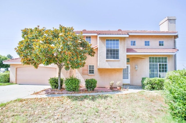 17076 E Cypress, Covina, CA 91722 - view of front of home featuring a chimney, stucco siding, a tiled roof, and concrete driveway