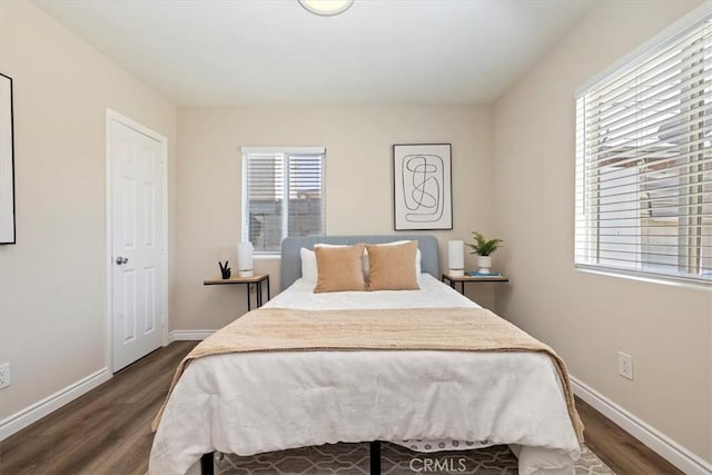 3900 Florence, Bell, CA 90201 - bedroom featuring dark wood-style flooring and baseboards