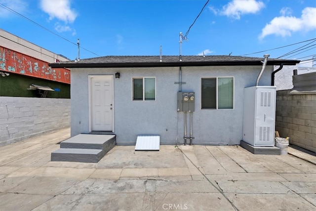3900 Florence, Bell, CA 90201 - rear view of house featuring stucco siding and a patio