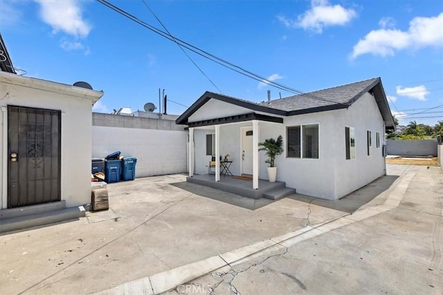 3900 Florence, Bell, CA 90201 - back of house featuring stucco siding and a patio area