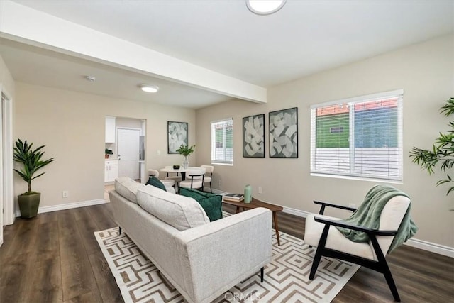 3900 Florence, Bell, CA 90201 - living area featuring dark wood-type flooring and beam ceiling