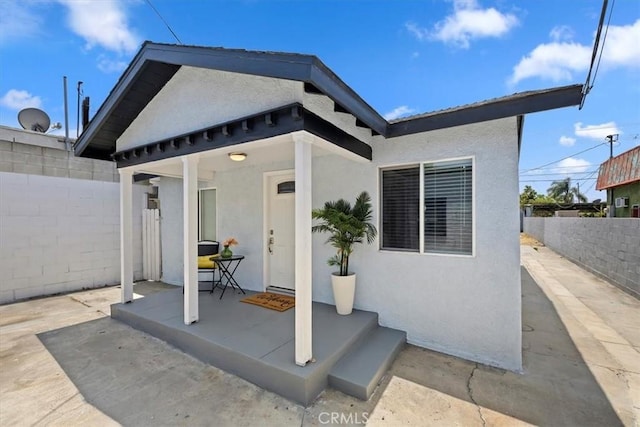 3900 Florence, Bell, CA 90201 - back of house featuring stucco siding and a fenced backyard
