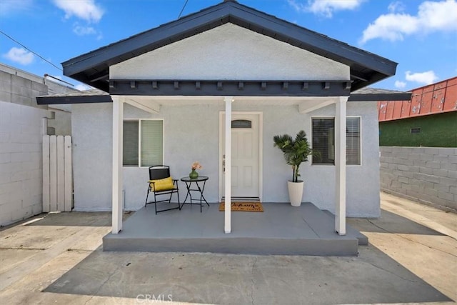 3900 Florence, Bell, CA 90201 - rear view of house featuring stucco siding and covered porch