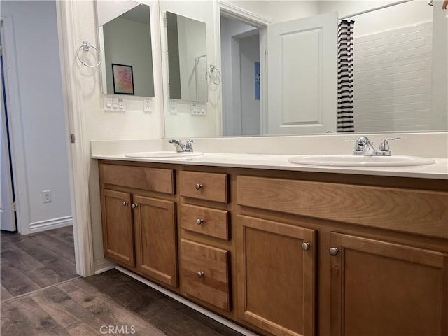 3071 E Silver Sky Dr, Ontario, CA 91762 - full bath featuring wood finished floors and double vanity