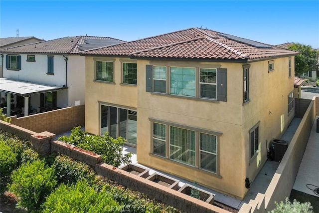 3071 E Silver Sky Dr, Ontario, CA 91762 - rear view of property with stucco siding and a tile roof
