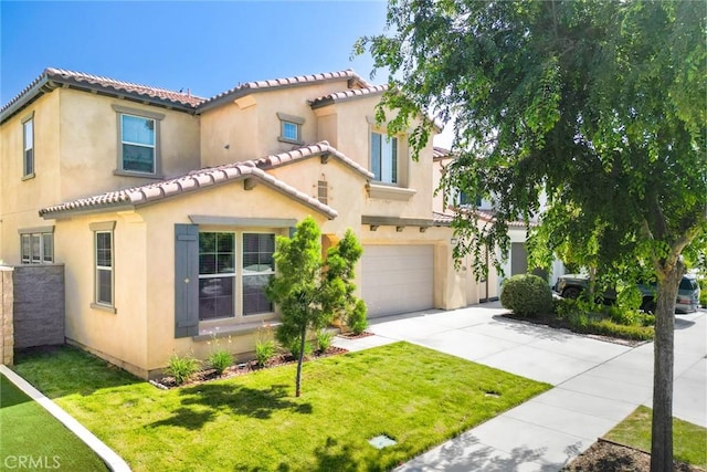 3071 E Silver Sky Dr, Ontario, CA 91762 - mediterranean / spanish-style house featuring a garage, concrete driveway, a tiled roof, a front lawn, and stucco siding