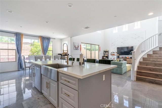 3071 E Silver Sky Dr, Ontario, CA 91762 - kitchen featuring dishwasher, healthy amount of natural light, a kitchen island with sink, open floor plan, and recessed lighting