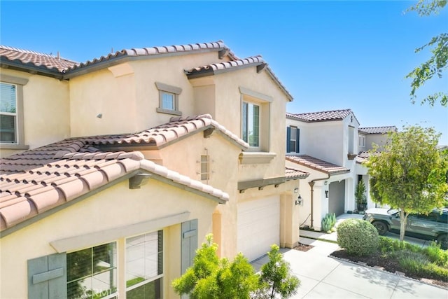3071 E Silver Sky Dr, Ontario, CA 91762 - mediterranean / spanish-style house with a tile roof, a garage, driveway, and stucco siding