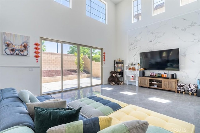 3071 E Silver Sky Dr, Ontario, CA 91762 - living room with marble tiled flooring, a high ceiling, and plenty of natural light