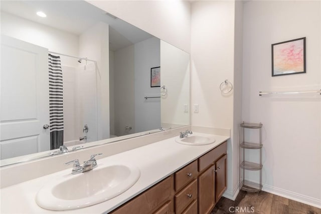 3071 E Silver Sky Dr, Ontario, CA 91762 - full bath featuring double vanity, wood finished floors, and recessed lighting