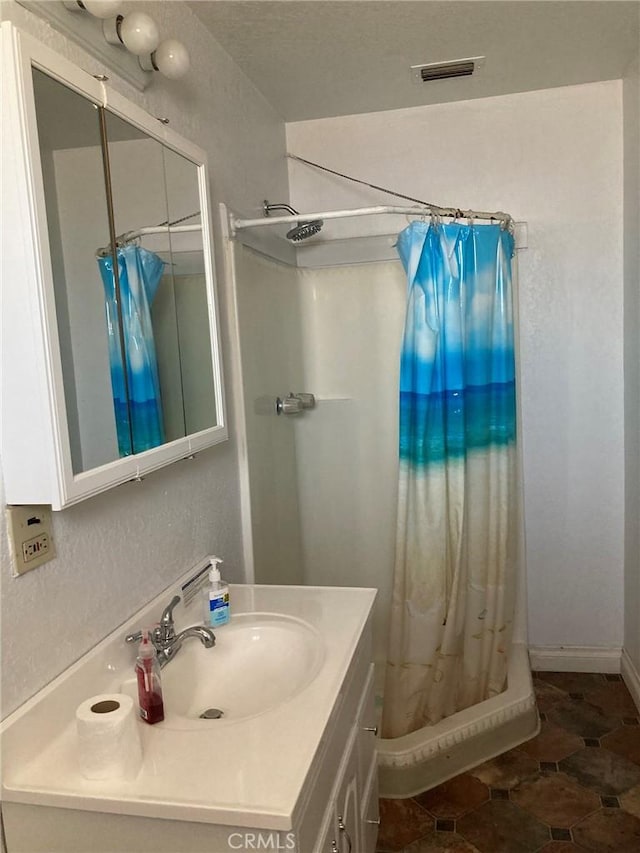 35590 Santa Fe St, Daggett, CA 92327 - bathroom featuring vanity and curtained shower