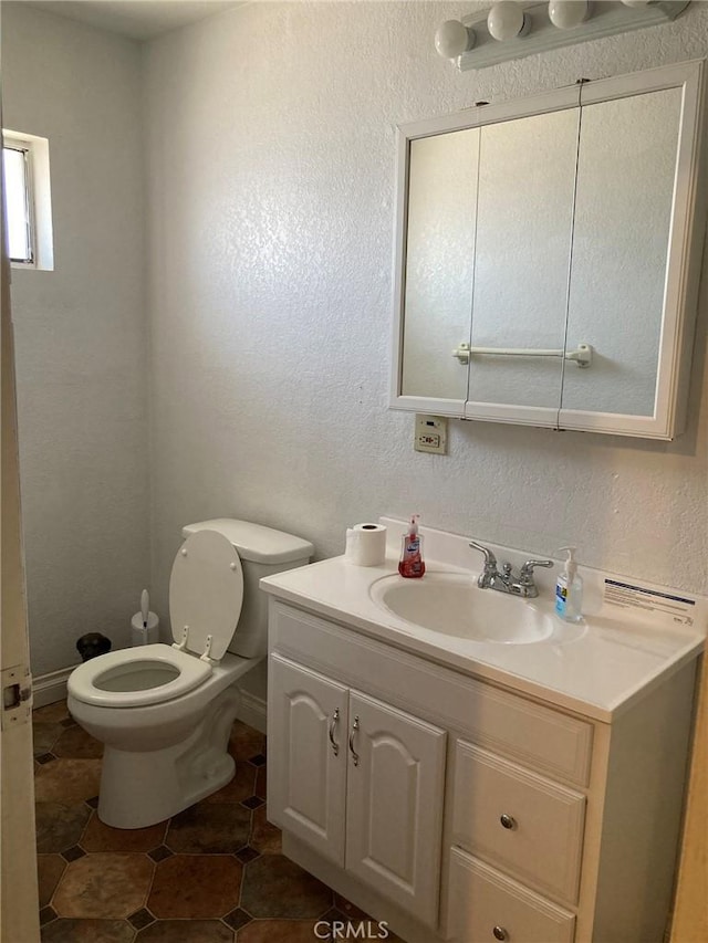 35590 Santa Fe St, Daggett, CA 92327 - half bath with vanity, a textured wall, and tile patterned flooring