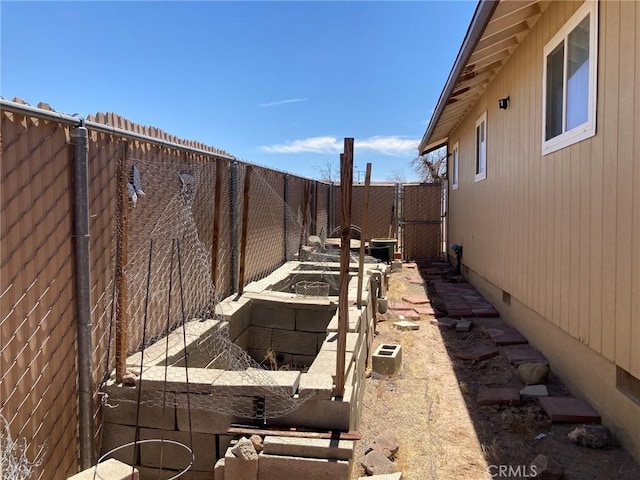 35590 Santa Fe St, Daggett, CA 92327 - fenced backyard featuring a vegetable garden