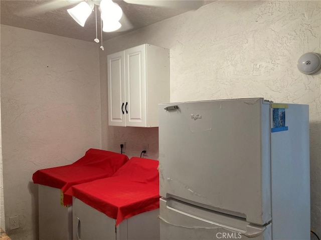 35590 Santa Fe St, Daggett, CA 92327 - laundry room featuring ceiling fan and a textured wall
