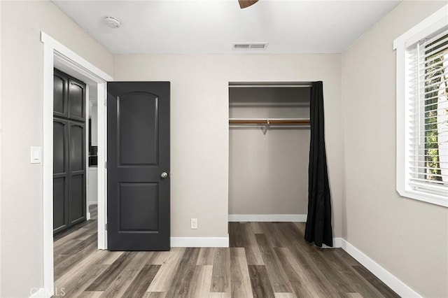 1131 Stewart Ave, Chico, CA 95926 - unfurnished bedroom featuring wood finished floors, a closet, and ceiling fan