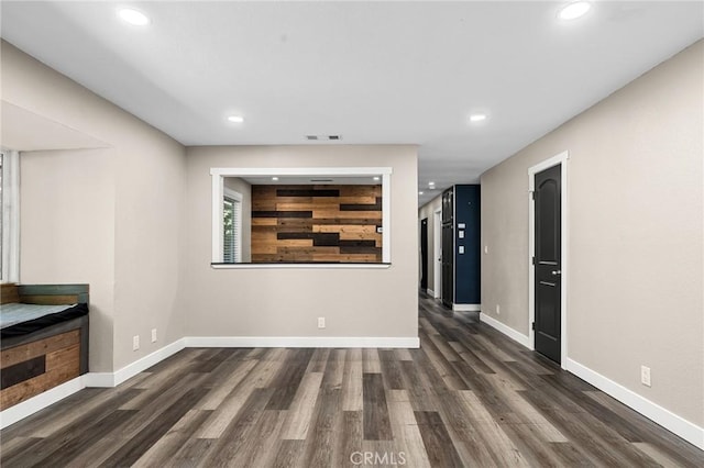 1131 Stewart Ave, Chico, CA 95926 - unfurnished living room featuring recessed lighting and dark wood-type flooring