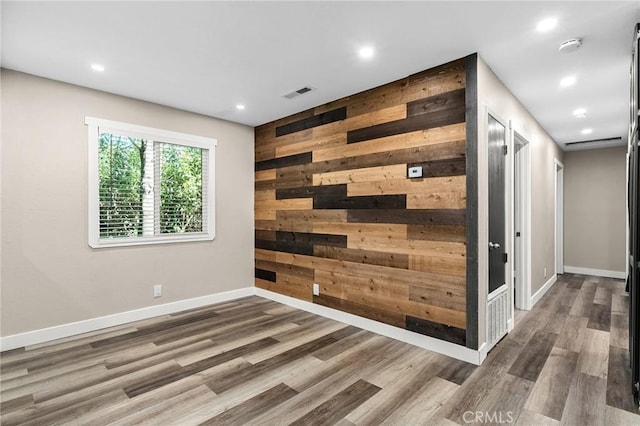 1131 Stewart Ave, Chico, CA 95926 - empty room with wood finished floors, wooden walls, recessed lighting, and a smoke detector