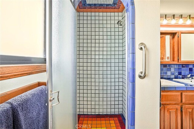 1323 Silvius Ave, San Pedro, CA 90731 - bathroom view of a shower stall, vanity, and backsplash