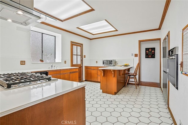 1323 Silvius Ave, San Pedro, CA 90731 - kitchen featuring stainless steel appliances, brown cabinetry, light floors, a peninsula, and extractor fan