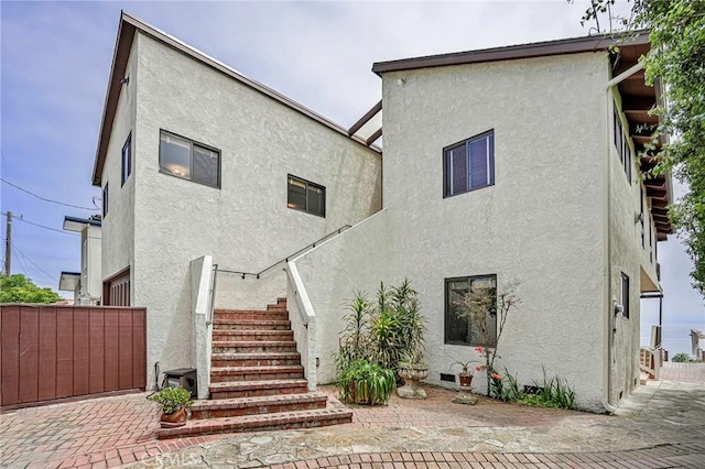 1323 Silvius Ave, San Pedro, CA 90731 - back of house featuring stucco siding and stairs