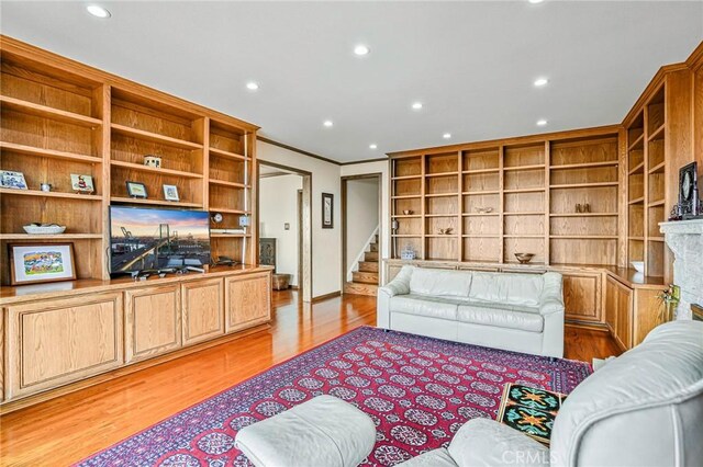 1323 Silvius Ave, San Pedro, CA 90731 - living room with light wood-type flooring, stairway, recessed lighting, ornamental molding, and built in shelves