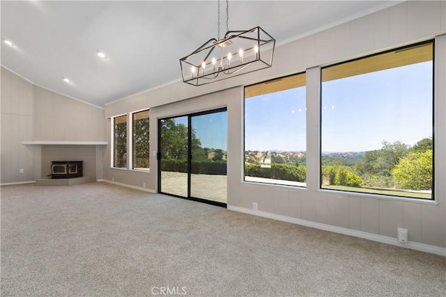 14220 El Monte Rd, Atascadero, CA 93422 - unfurnished living room with vaulted ceiling, carpet, a chandelier, ornamental molding, and a glass covered fireplace