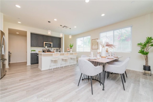 1504 Granada Rd, Upland, CA 91786 - dining space with light wood-style floors and recessed lighting