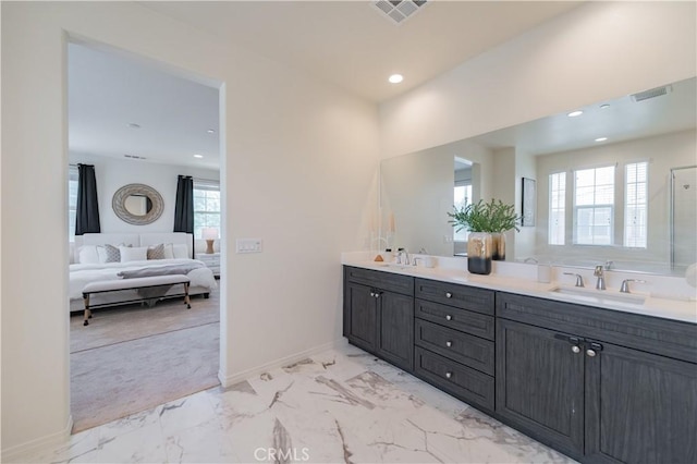 1504 Granada Rd, Upland, CA 91786 - bathroom featuring ensuite bath, double vanity, plenty of natural light, marble look tiles, and recessed lighting