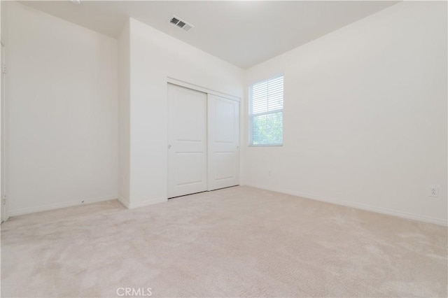 1504 Granada Rd, Upland, CA 91786 - unfurnished bedroom with light colored carpet and a closet