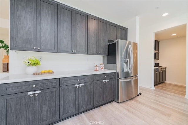 1504 Granada Rd, Upland, CA 91786 - kitchen featuring stainless steel fridge, light wood-style flooring, light countertops, and recessed lighting