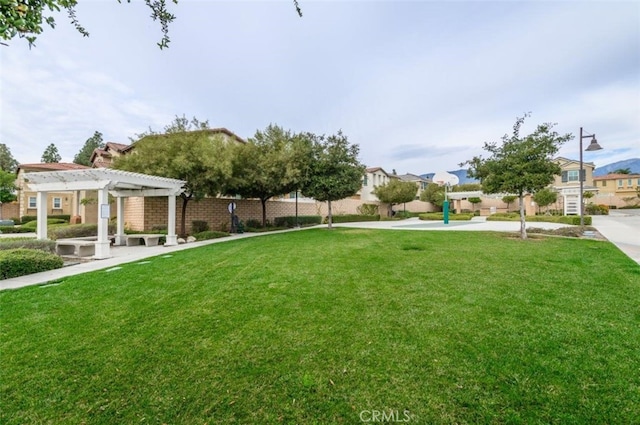 1504 Granada Rd, Upland, CA 91786 - view of grassy yard with a pergola and a residential view