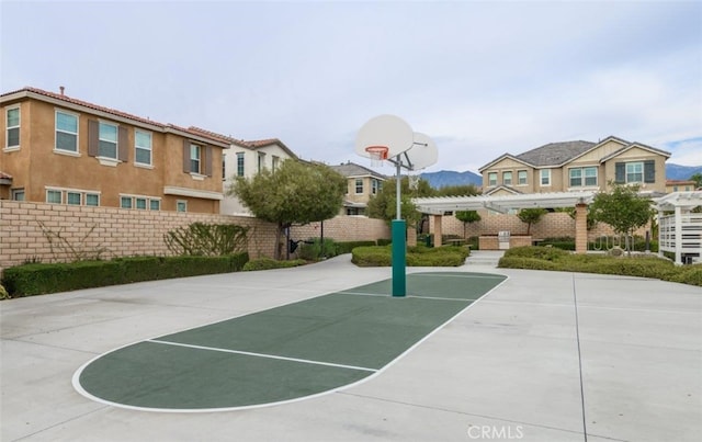 1504 Granada Rd, Upland, CA 91786 - view of sport court featuring community basketball court, a pergola, and a residential view